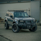 Toyota Prado 250 Series SUV with a black Diablo Bull Bar installed on the front. The vehicle is parked, and the bull bar features LED lights and a rugged design.