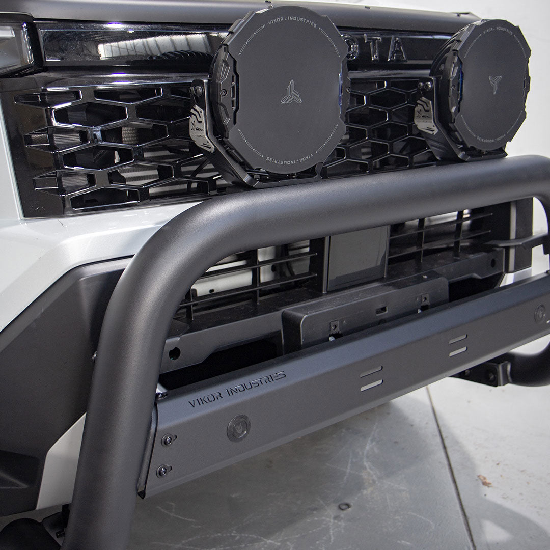 Close-up of a vehicle's front bumper with 'Viktor Industries' branding on a gray background.