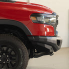 Red pickup truck with black bumper in a warehouse setting